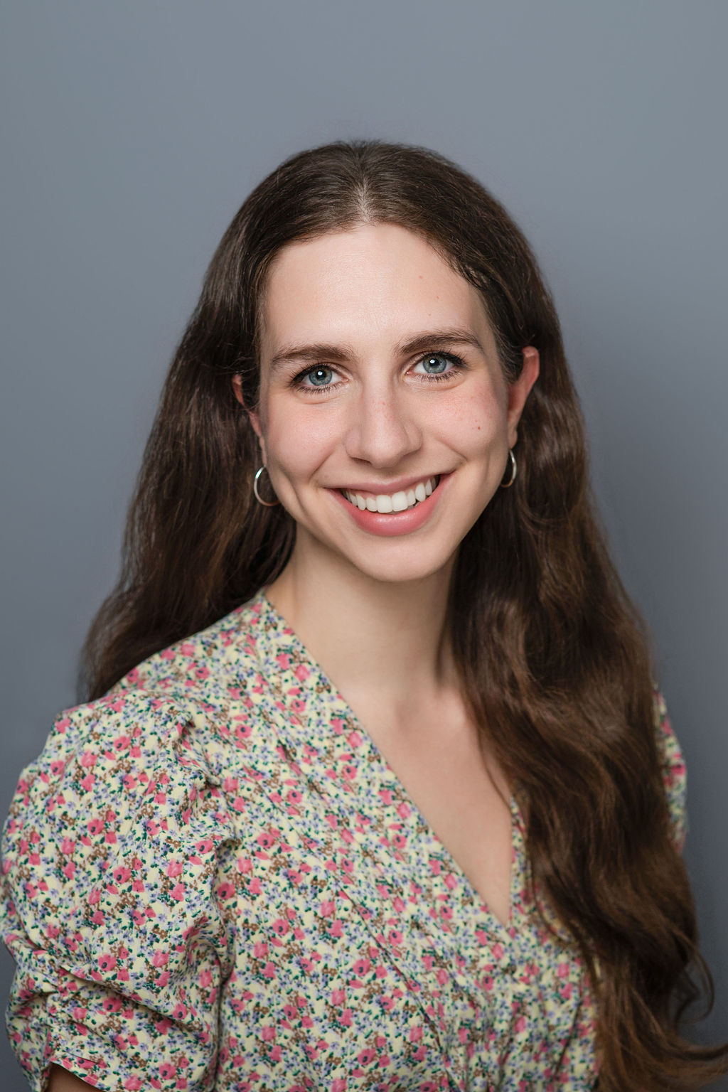 Smiling woman with long brown hair portrait