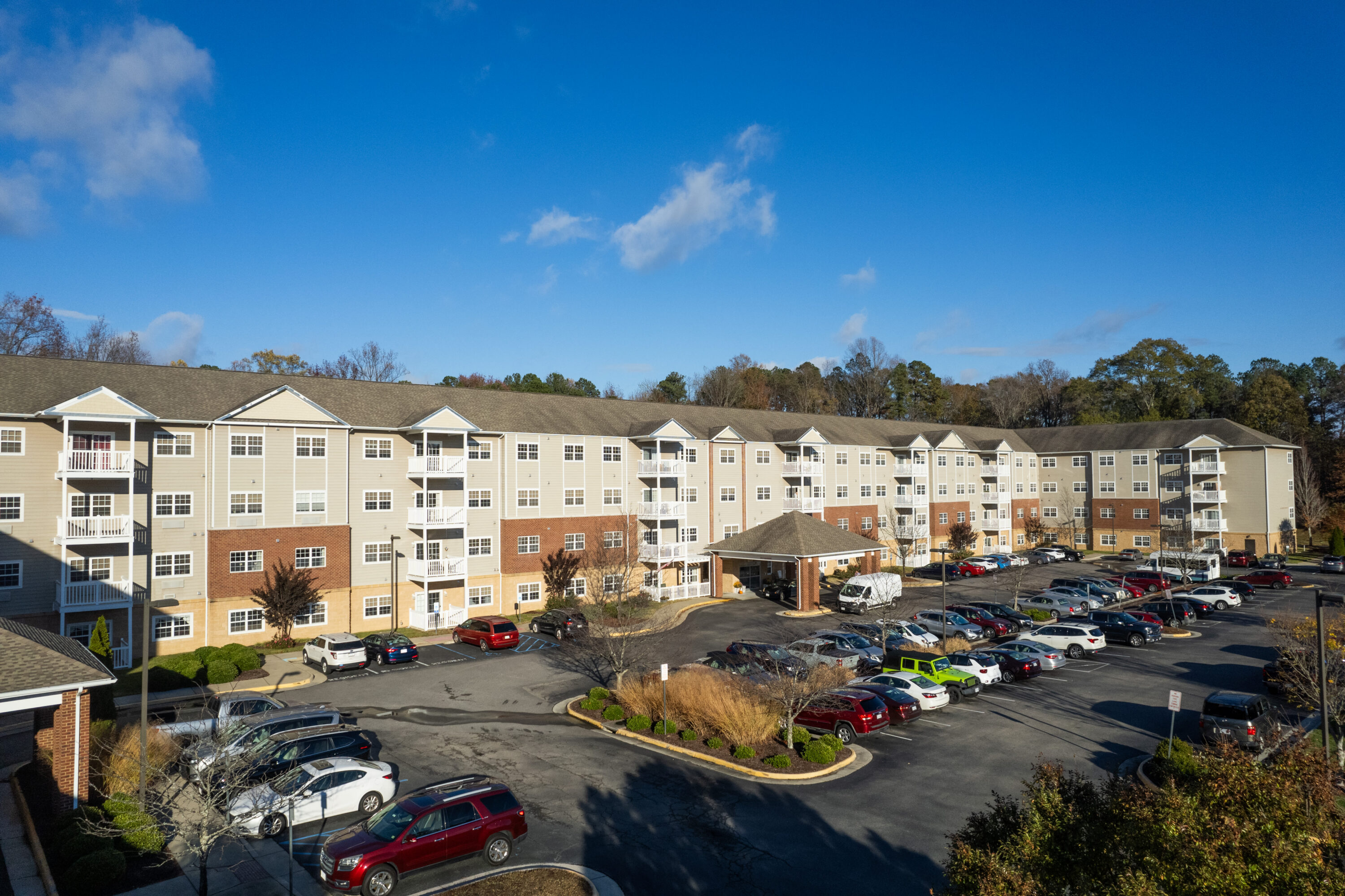 Large apartment complex with full parking lot