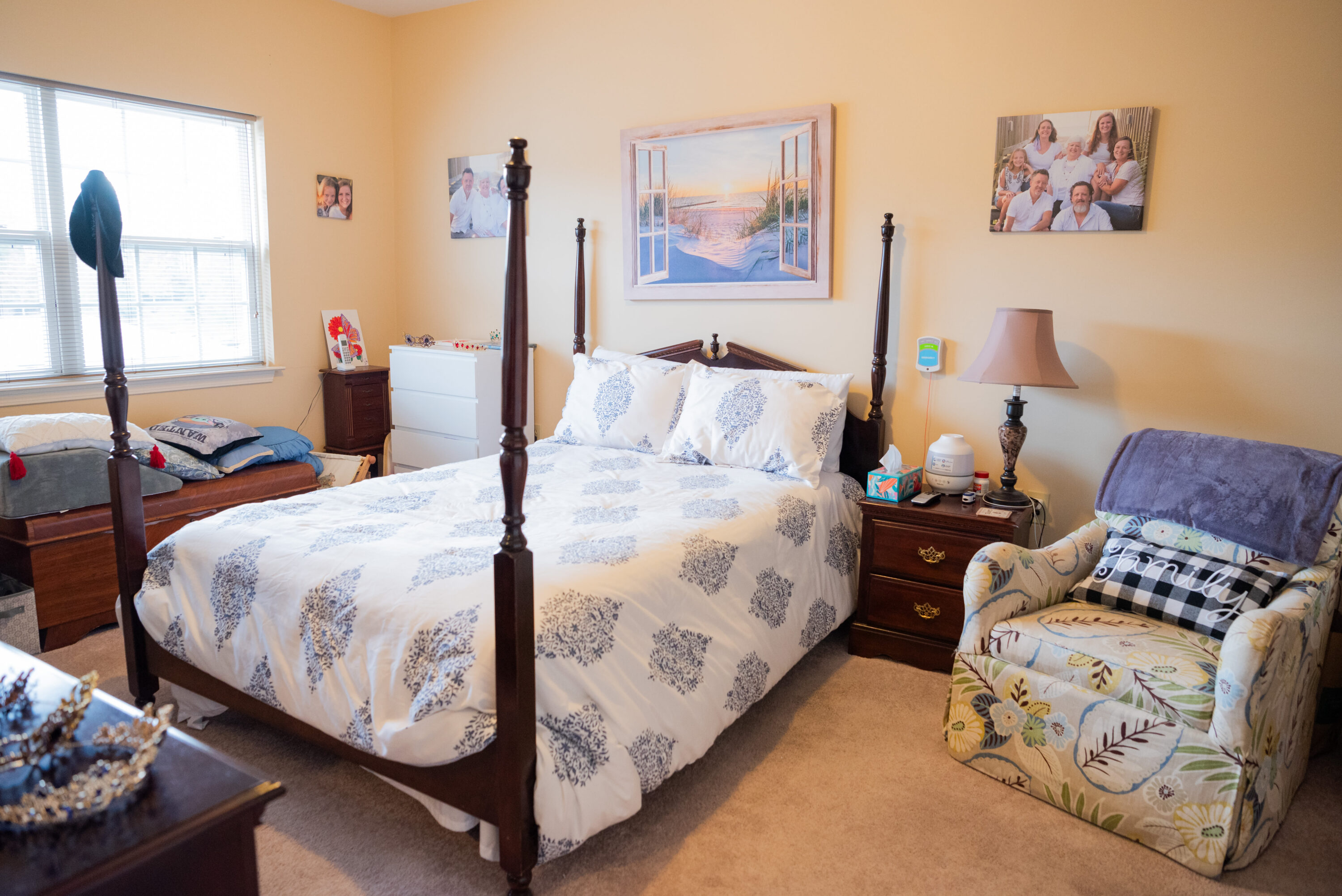 Cozy bedroom with four-poster bed and armchair